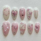 Cyflymder 24Pcs Pink Smudge Press on Fake Nails Mid-length Almond Reusable False Nail Bow Heart Rhinestone Pearl Full Cover Nails Tips Art