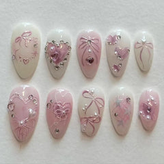 Cyflymder 24Pcs Pink Smudge Press on Fake Nails Mid-length Almond Reusable False Nail Bow Heart Rhinestone Pearl Full Cover Nails Tips Art